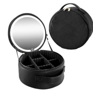 Round black travel jewelry case with a built-in mirror, opened to show divided compartments for accessories.