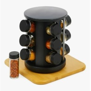 Rotating Spice Rack with Black-lidded Jars on a Wooden Base; a Small Chili Flakes Bottle Sits Beside It.
