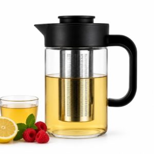 Glass Teapot with a Stainless Steel Infuser and Black Lid, Filled with Tea; Beside It a Cup of Tea, a Lemon Half, Raspberries, and Mint on a White Background.