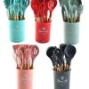 Five Pastel-colored Kitchen Utensil Sets in Matching Cups (turquoise, Red, Light Gray, Pink, and Dark Gray), Each Containing Spatulas, Whisks, Tongs, and Spoons.