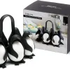 Boxed Set of Black-and-white Penguin Egg Holders Arranged with a Black Box Labeled Egguins: Cook, Store & Serve Egg Holder; Penguin Shapes Used to Hold Eggs.