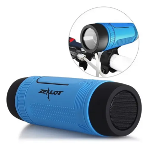 Blue cylindrical Zealot portable Bluetooth speaker with black ends and textured grip, shown with a circular close-up of its bike-mount attachment.