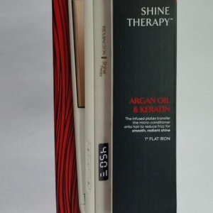 Remington Shine Therapy hair straightener box with white flat iron and red/black packaging showing Argan Oil & Keratin benefits.